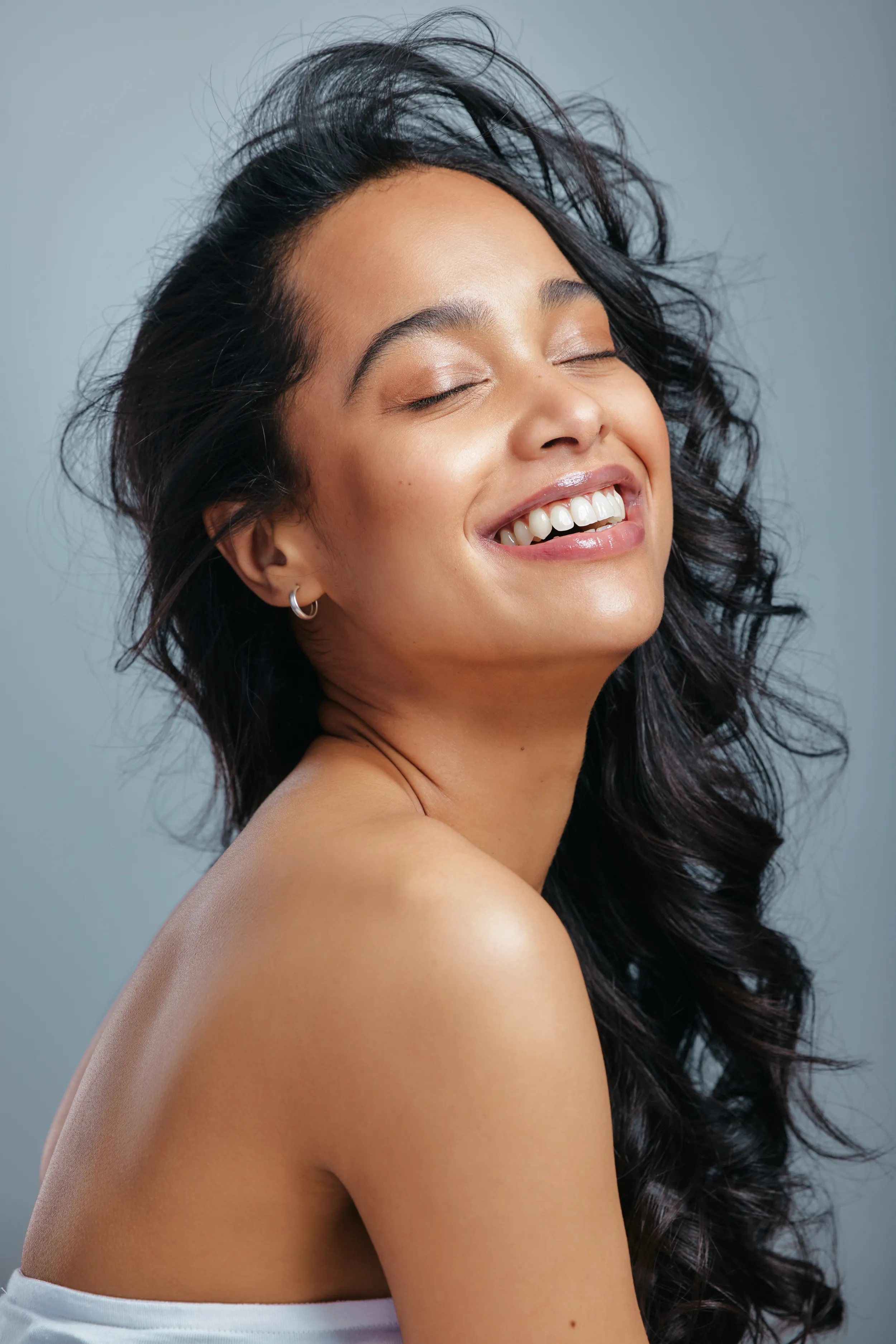 Happy woman with healthy hair and skin